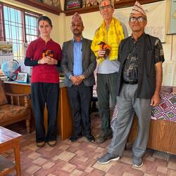 Welcome to our school--khata (scarf), tika (red paste) blessing and flower bouquet