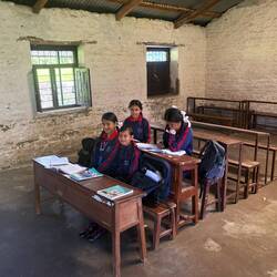 The girls on the other side of the classroom look happier