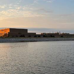 We motor past the Caterpillar plant VISITOR CENTRE in the early morning sun