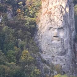 Stone face carving of King Decebalus
