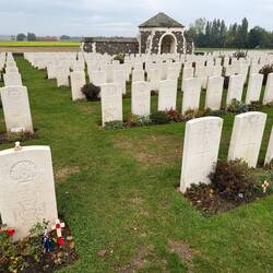 Lewis McGee's grave front left and Hamburg Redoubt where he won his VC is the farmhouse on the right