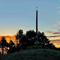 Placing my stone at the Cruz de Ferro.