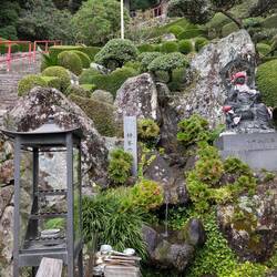 Hand washing is at a mountain stream in a steep garden