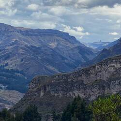 As we descend we are intrigued by the finger of rock on the far horizon