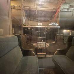 Pullman Sleeper interior through a dirty window
