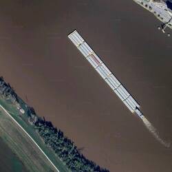 What a barge tow on the Mississippi looks like when viewed by Google Earth