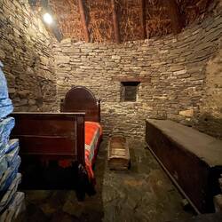 Inside a palloza, which housed people and animals.