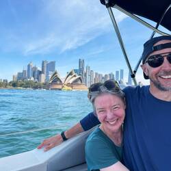 We're in a little boat going past the Sydney Opera House (!)