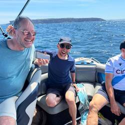 Matt, Lilz and Wardie on the 'Vortex' motorboat looking for whales