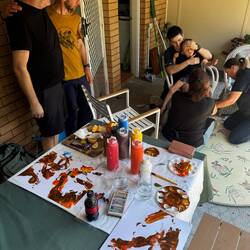 Ana, Sebastian and Mel introducing the concept of colour and painting to Archie