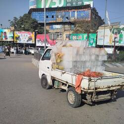 A micro truck delivering ice, ice, babe