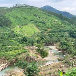 Very clear river cutting through valley