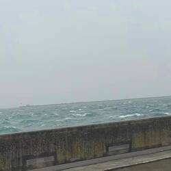 Watching the storm form outside, from inside the harbour walls