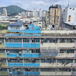 Rooftop residences are 'protected' with corrugated steel. They're illegal, but no one enforces it.