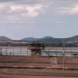 And all along the river is a double-walled fence with guard towers ensuring no one crosses over.