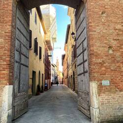 The ancient wooden doors into Buonconvento