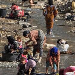 Women washing at river
