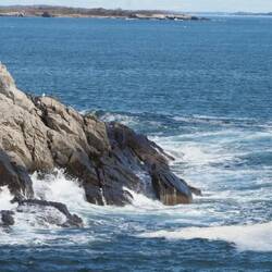 Waves of the rocks by the lighthouse