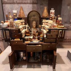 APOTHECARY DESK ITALIAN MANUZIO ACQUIRED 2002 Doll sized desk with apothecary instruments and suppli
