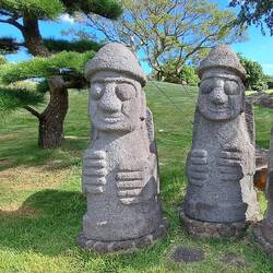 These guys are called 'Dol Harebugang': symbol of Jeju. All are smilers. 😊