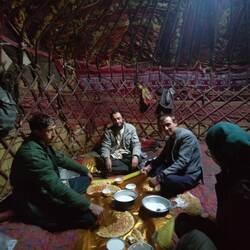 Up with the Kyrgyz: Enjoying yak cream and yak yoghurt in a yurt. Later: IronChris with funny belly.