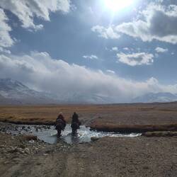 A young family riding home with their child after a visit in the clinic. Seems to be far, home.