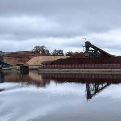 Loading woodchips and pulp along the waterway