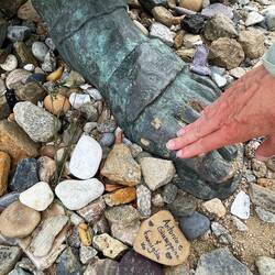 Touching the pilgrim's feet, which I've done with the statues throughout my journey.