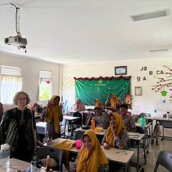 A late career Peace Corps Volunteer with her students