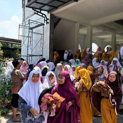 Boisterous crowd of students coming out of prayer