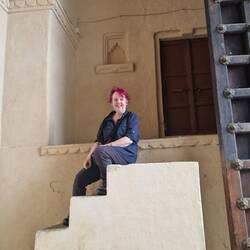 Sitting on the steps used to climb on the elephants