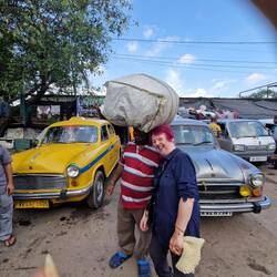 The guy was chatting with friends even though this was on his head