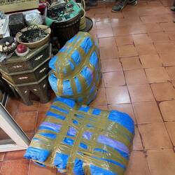 The carpets are packed and ready for shipment by DHL