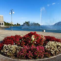 The lakefront promenade welcomes visitors with a dancing fountain — Pallanza, Italy.