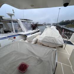 A big DeFever rafts against us as 10 boats follow in