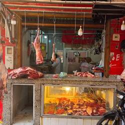 Butcher shop next to boutique