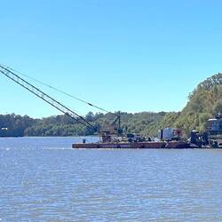 Approaching our destination, a work-barge is conducting 'underwater work' with Diver Below flags