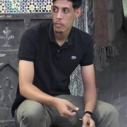 Salah Nasiri runs "artisanats africain" art and cloths while his father drives around west Africa.