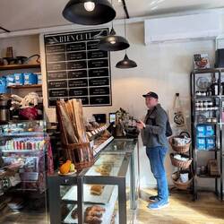 Our Tour Guide buying us croissants