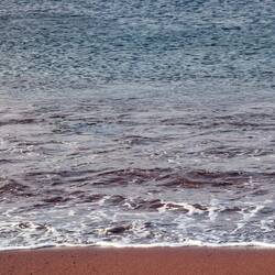 Red sand and blue water. It feels like a different planet.