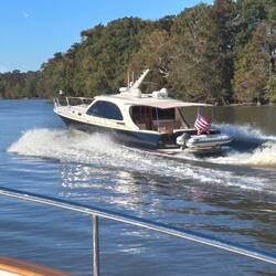 The other one passes. Google tells me it's a 'Palm Beach' motor yacht, likely a PB52 or PB55