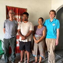 Tall volunteer with host family