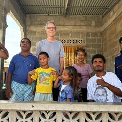 Grandfather raising several grandkids shown with Peace Corps Volunteer