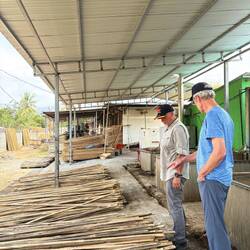 Volunteer explaining bamboo production