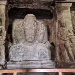 Inside the cave...note the 3 faces on this carving