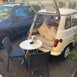 A Roman cafe that made maximum use of the cars parked outside it