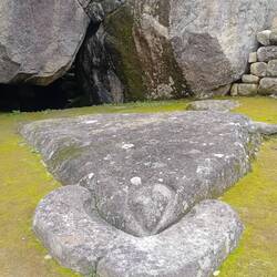 This flat rock was carved as a Condor with (front to back) collar, head with beak, body