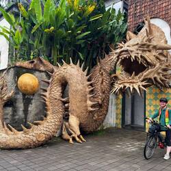 The coolest dragon sculpture 🐉 that we cycled upon!