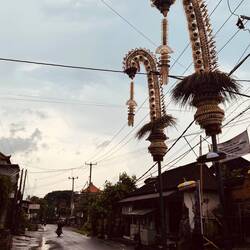 Penjor often line the streets. Ceremonial decorations and religious symbols in Bali Hindu tradition.