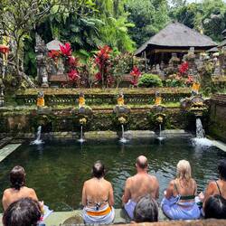 Tourists partaking in Melukat, water purification ritual at Pura Gunung Kawi Sebatu